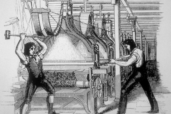 Picture of Luddites destroying machinery