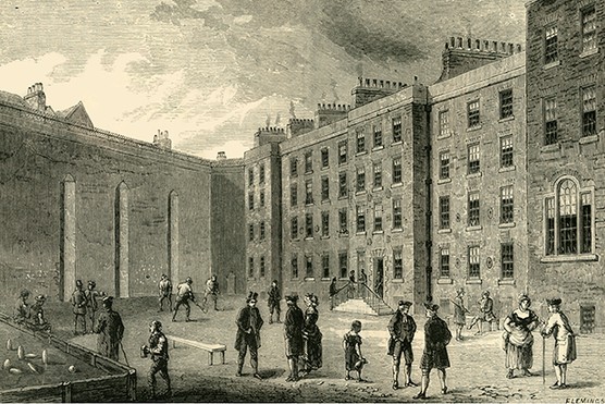 Prisoners exercise and play sport in the courtyard of the Fleet Prison, circa 1872