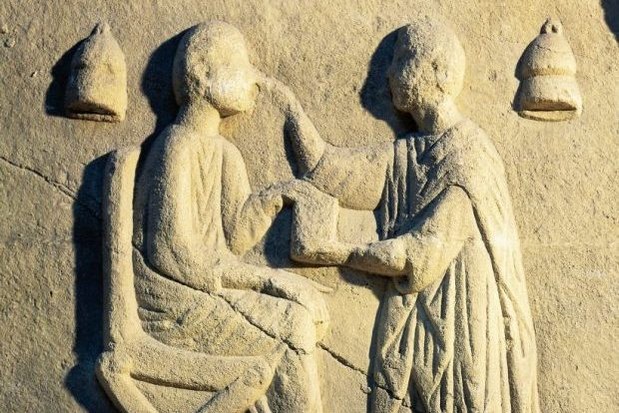 A Roman relief portraying an ophthalmologist examining a patient