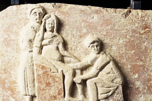 An ancient Roman relief depicting scene of childbirth.